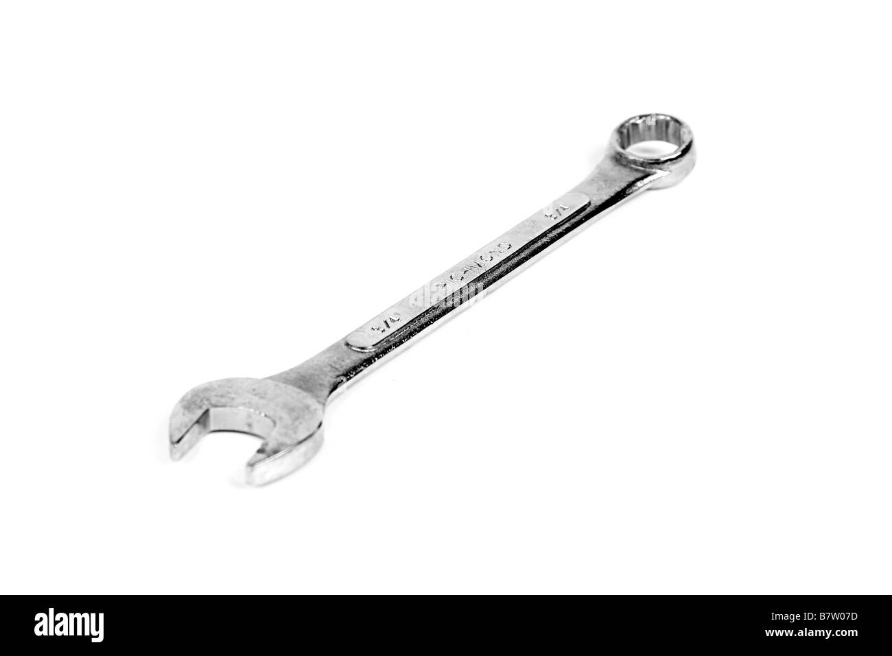 A combination open ended and ring spanner against a white background Stock Photo