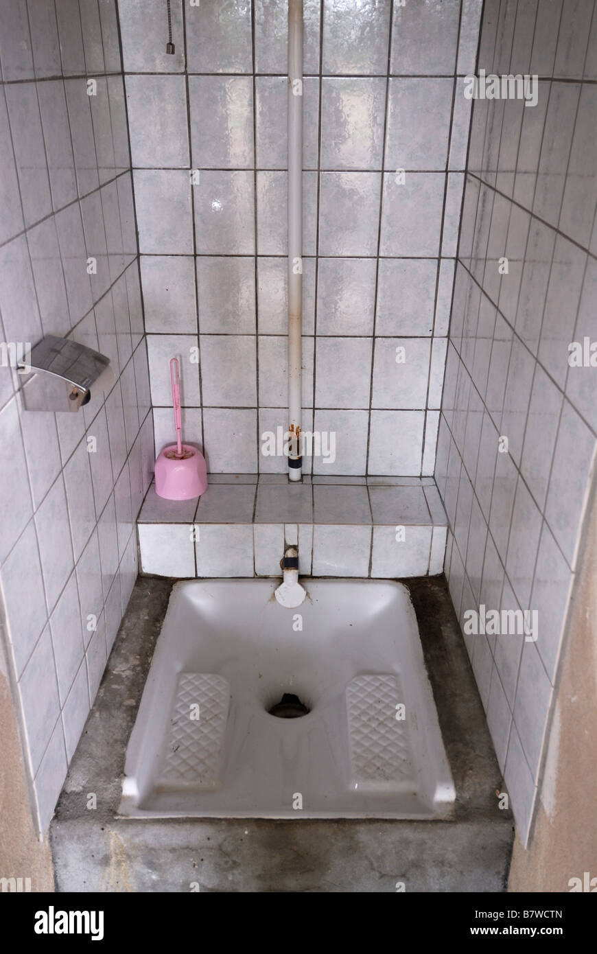 Traditional French squat down toilet known as toilette à la Turque Stock Photo