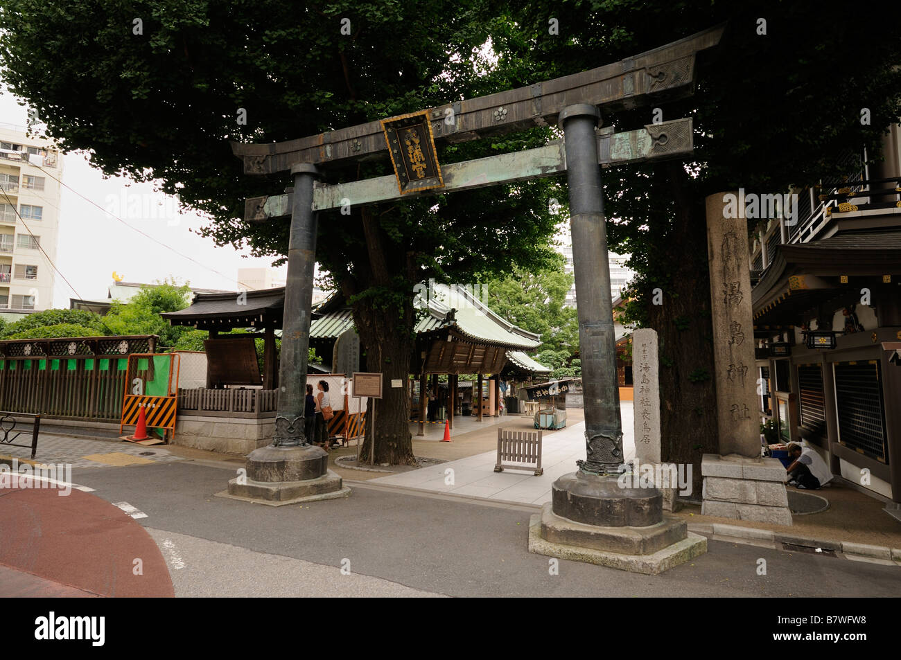 Torii at the main entrace to Yushima Tenjin Shrine. Founded in 1355 and restored in 1478. Ueno. Tokyo. Japan Stock Photo