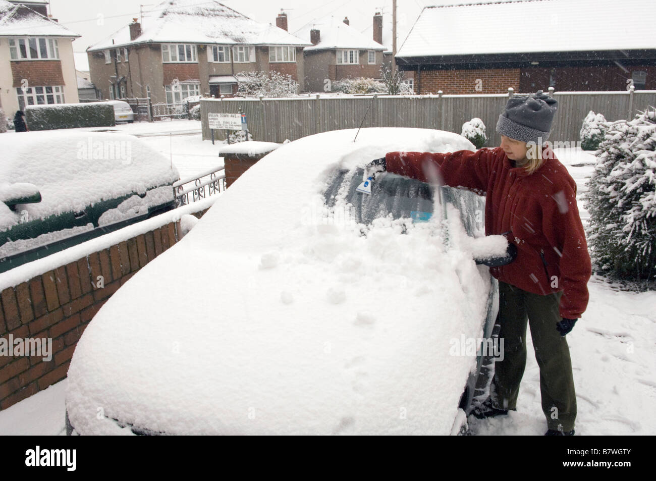 Person wiping snow from car hires stock photography and images Alamy
