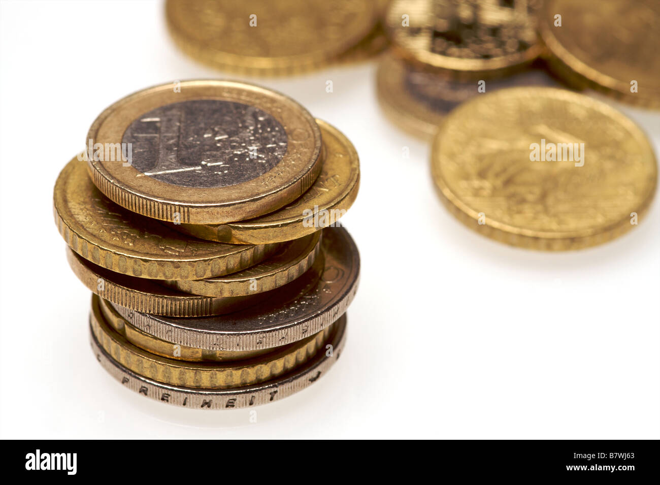 a selection of euro coins on a white background Stock Photo - Alamy