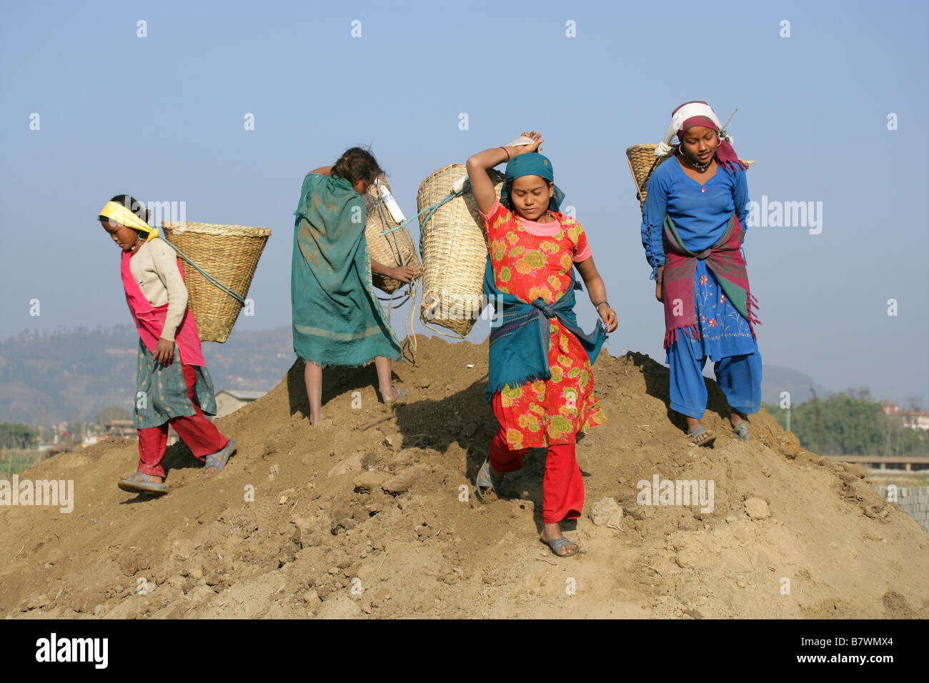 Women and girls labouring at a Nepalese brick factory Stock Photo
