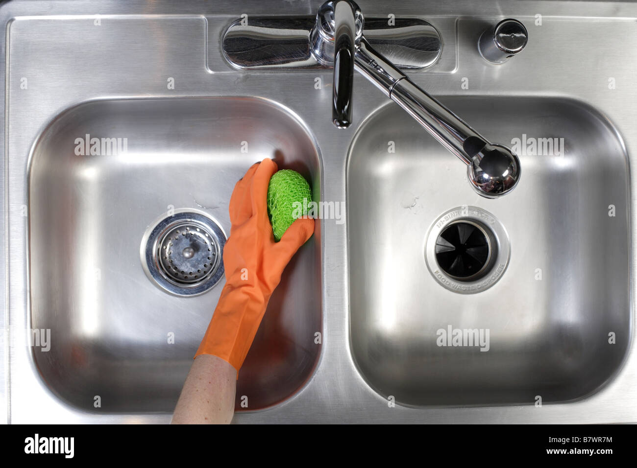 Cleaning a stainless steel sink Stock Photo Alamy
