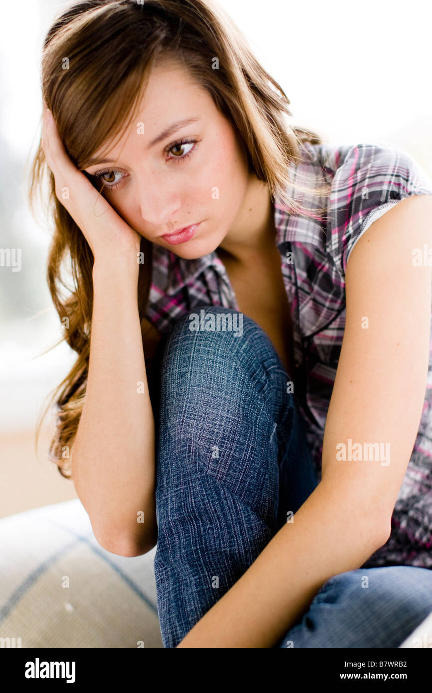 Stressed Girl with hands on her head Stock Photo