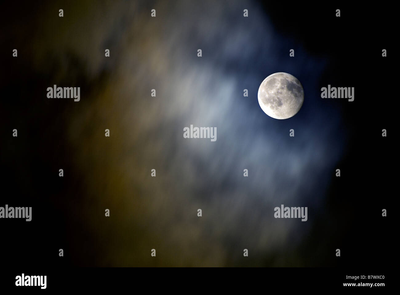 MOON SHOT  IN A CLOUDY NIGHT SKY Stock Photo