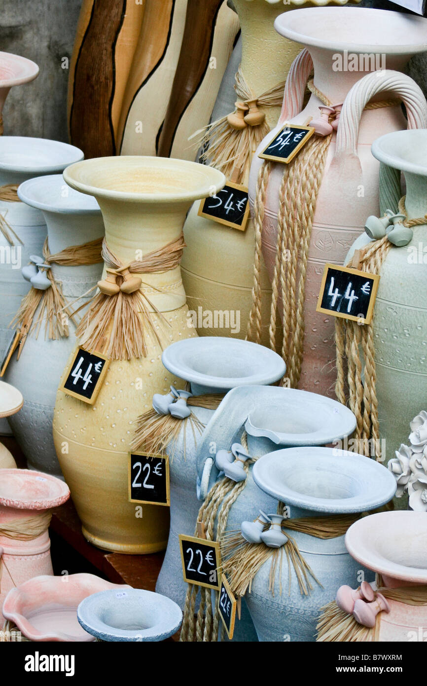 Pastel colored pots from a french market with simple price tags hanging in front of each of them with their prices out in Euros. Stock Photo