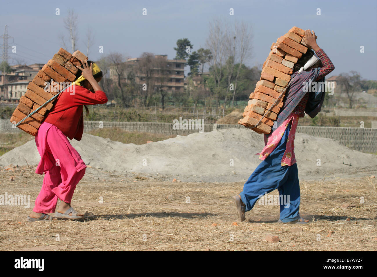 Three Men Carrying Bricks On Their Head, From The Back, In A Fine Art
