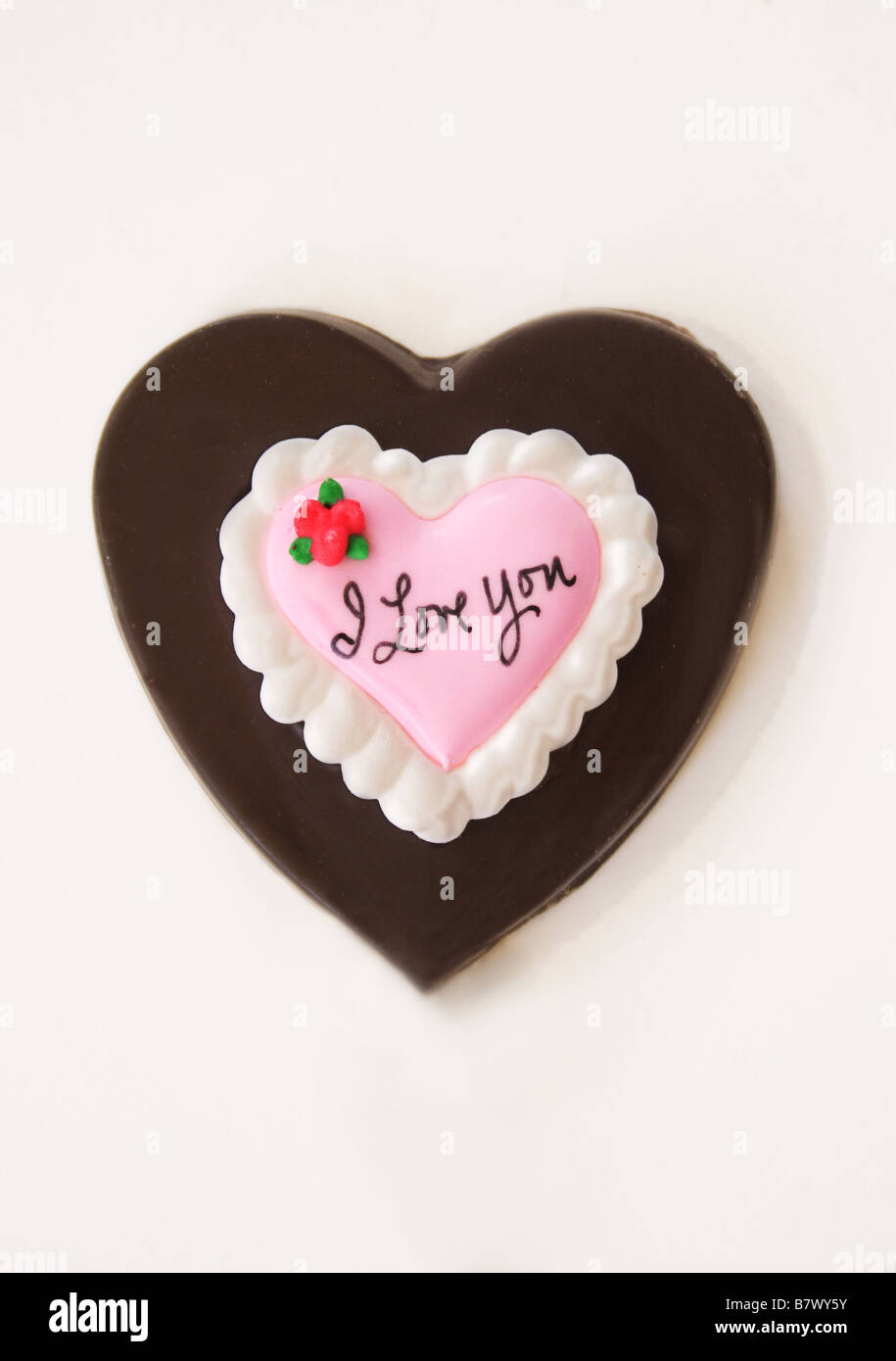 Valentine chocolate heart on a white background. Stock Photo