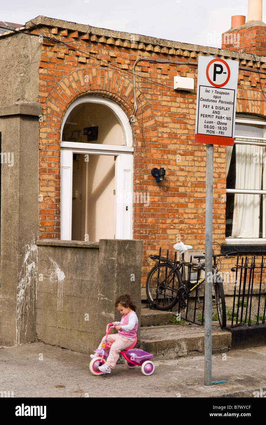 Young girl on her tricycle, Dublin Ireland, August 2006 Stock Photo Alamy