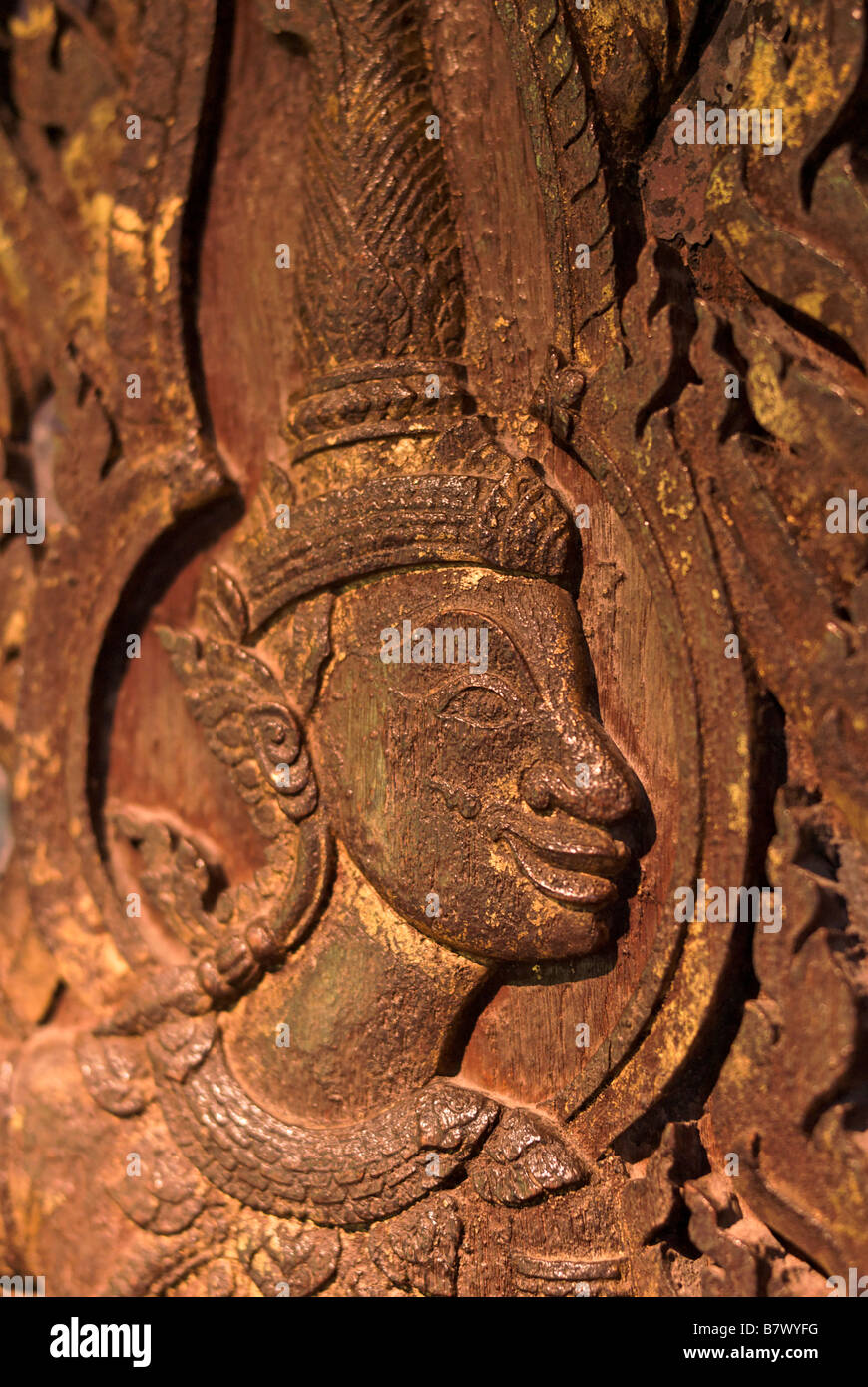 Relief carving on teak door Jim Thompson s House Museum in central Bangkok Thailand Stock Photo