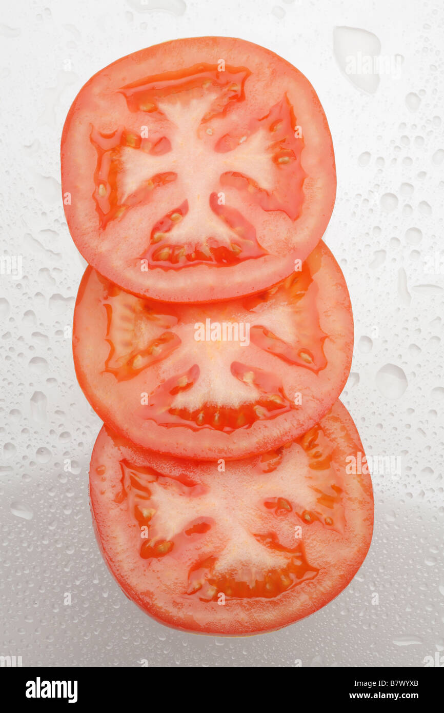 Tomatoes, slices, close-up, studio shot Stock Photo