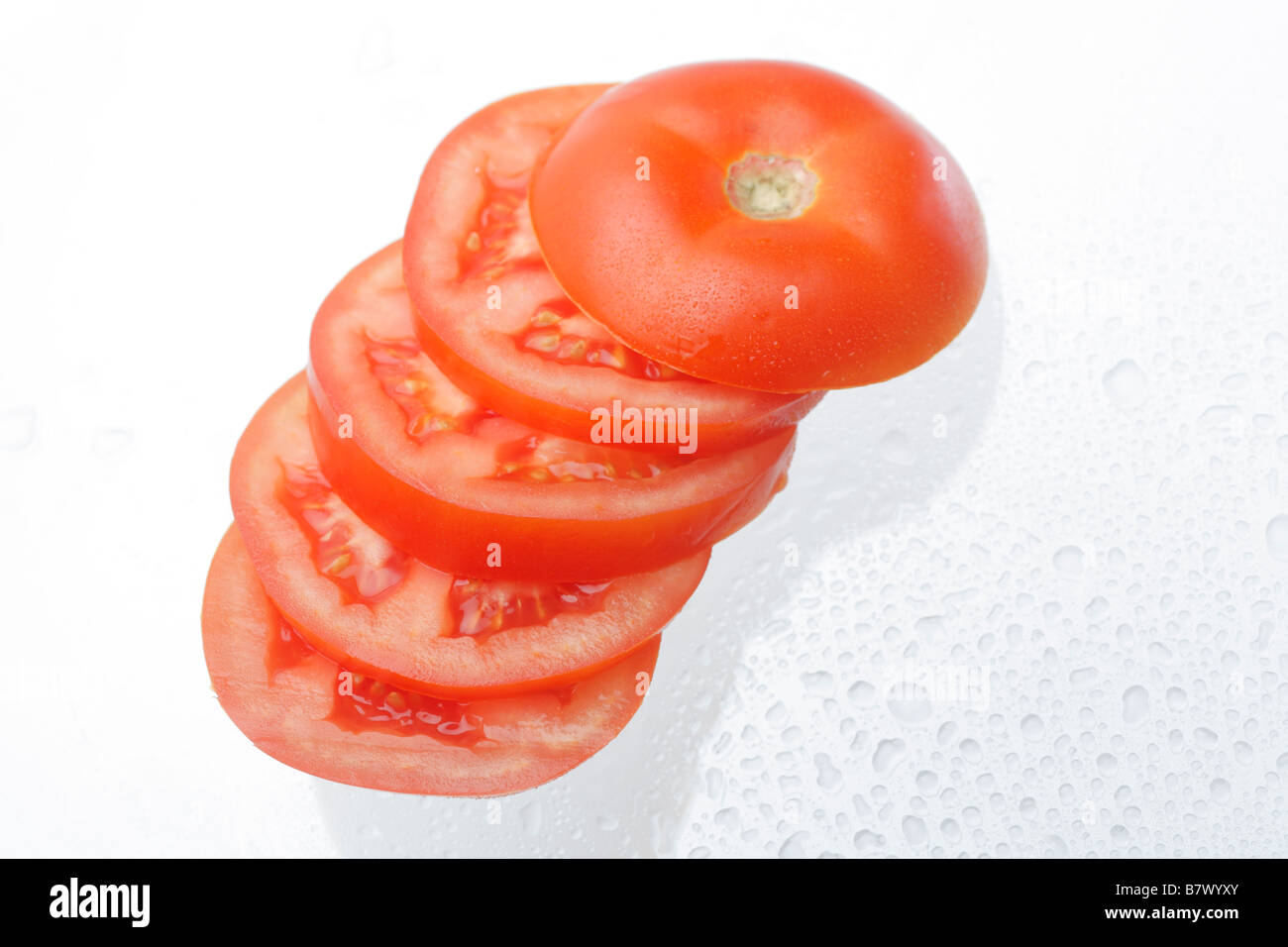 Tomatoes, slices, close-up, studio shot Stock Photo