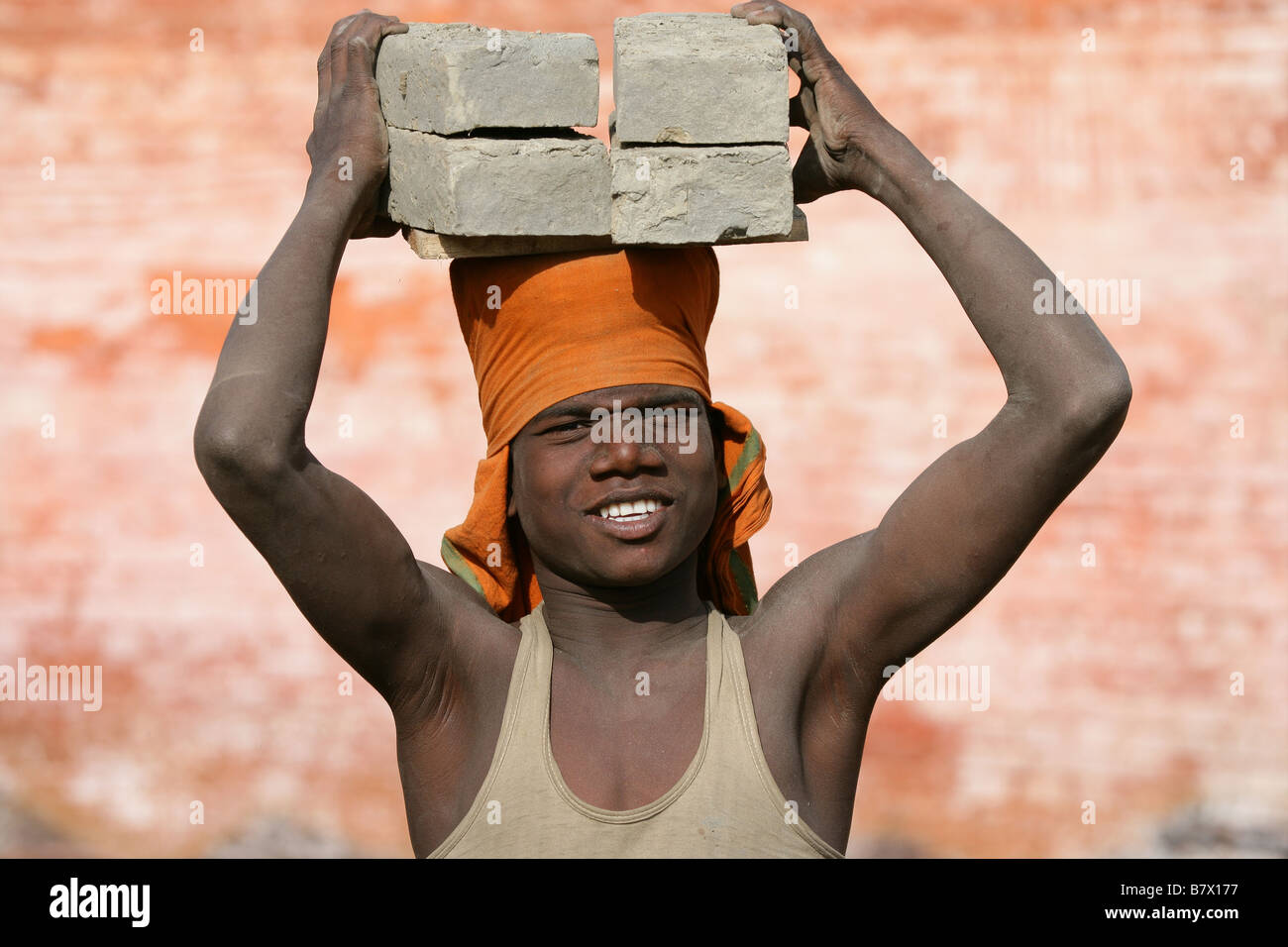 Bricks on head Stock Photo Alamy