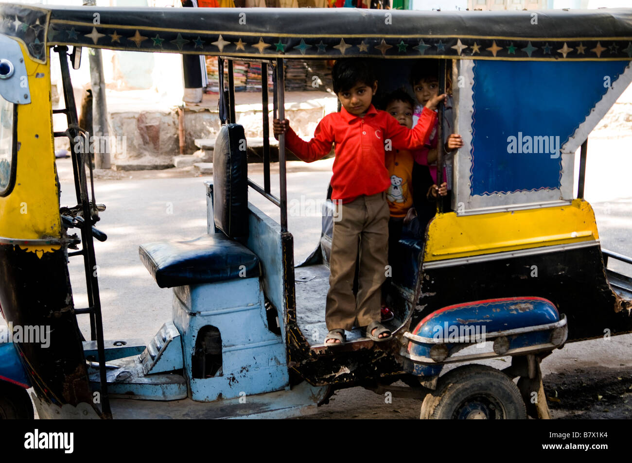 Indian boys in an auto rickshaw. Stock Photo