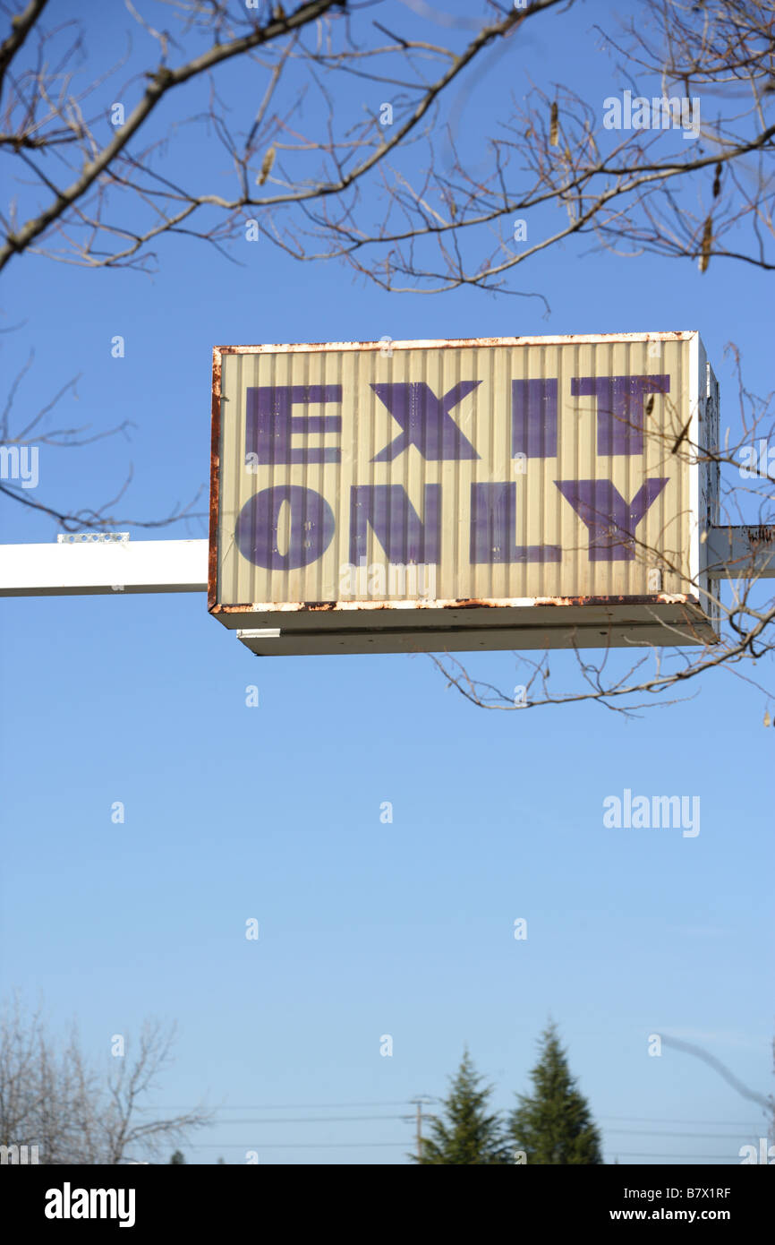 An old Exit only sign in a parking lot Stock Photo