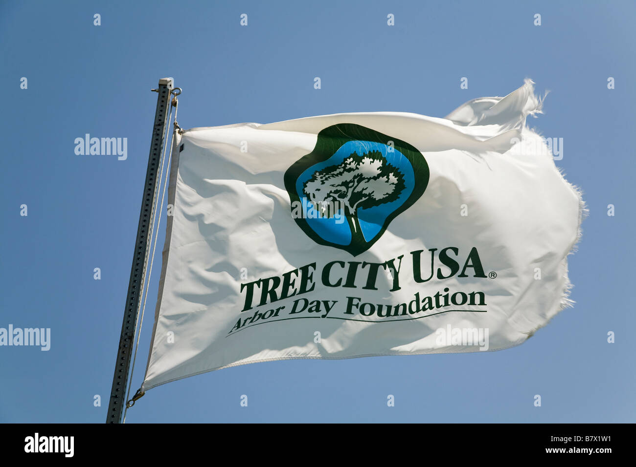 ILLINOIS DeKalb Arbor Day Foundation Tree City USA designation on flag waving in wind Stock Photo