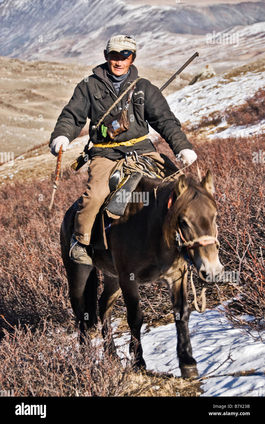 Mongolia horse ride rifle hires stock photography and images Alamy