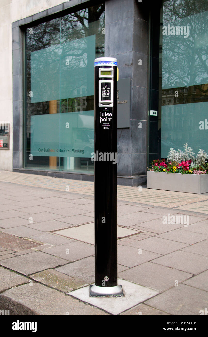 A full sized view of an EDF on-street electric car recharging (juice) point on Berkeley Square, London.  Jan 2009. Stock Photo