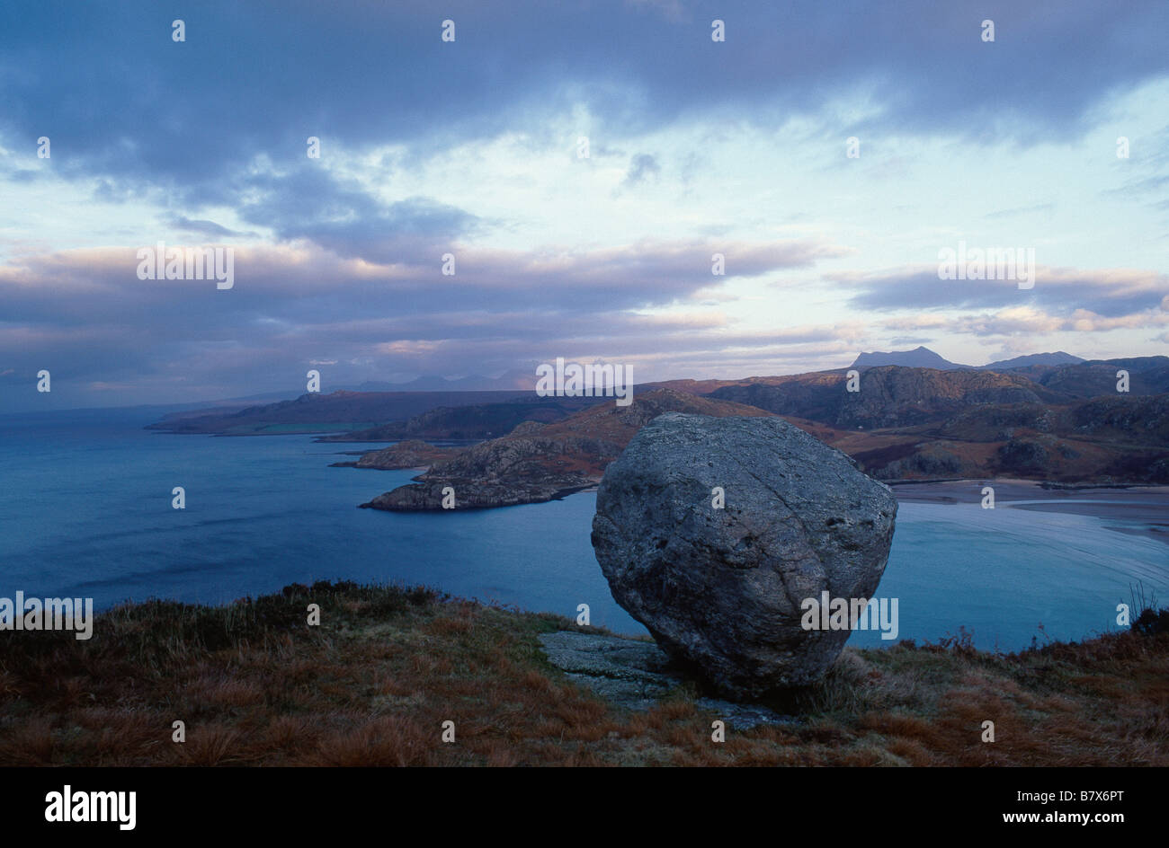 Sunrise sunset Silhouette of hills Pink cloud light in sky Bay shore