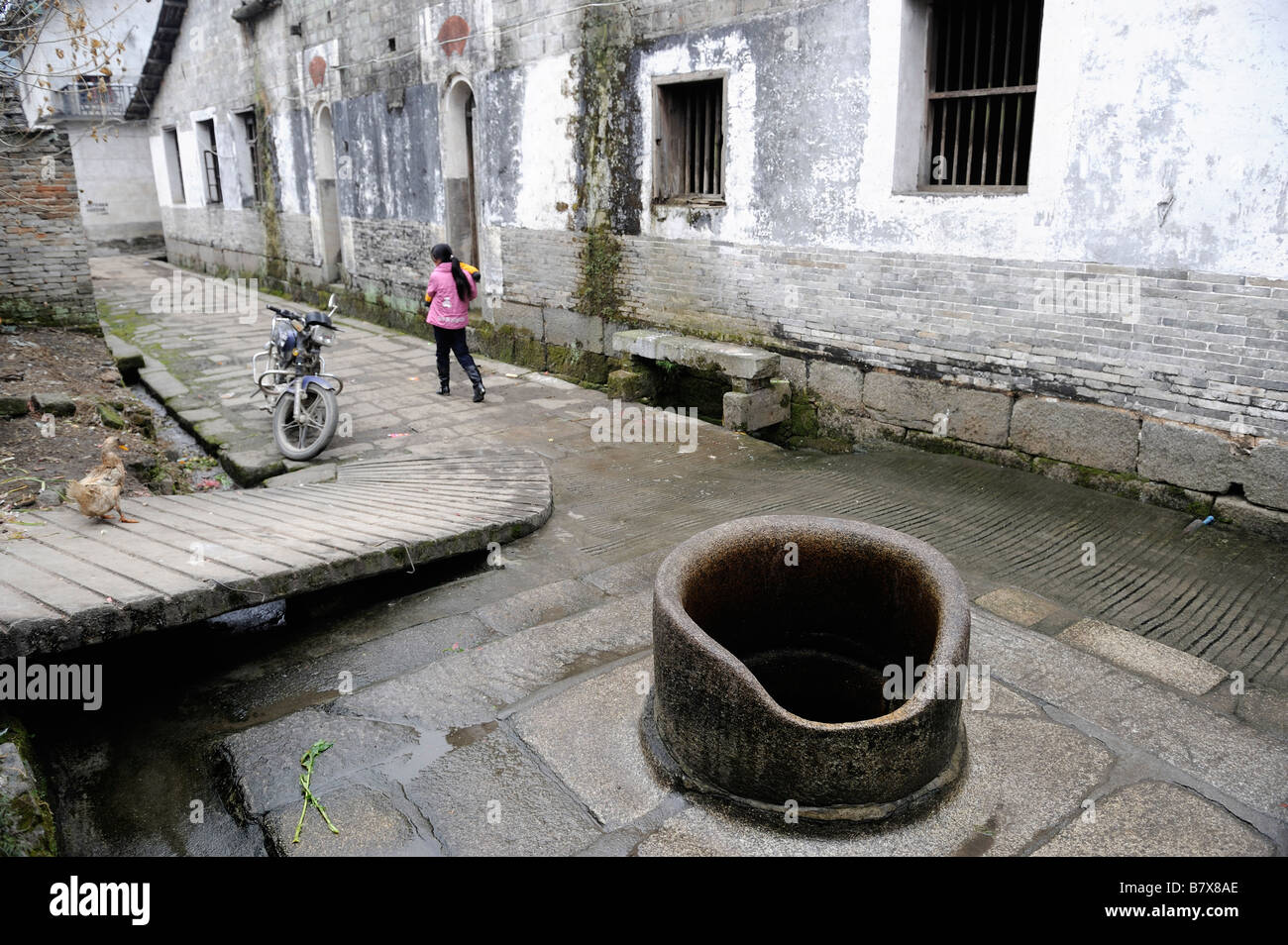 Ancient water well is still used in Tianbao village, Yifeng, Jiangxi, China. 02-Feb-2009 Stock Photo