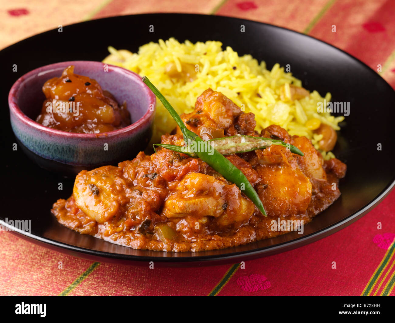 Kashmiri curry and saffron rice Stock Photo Alamy