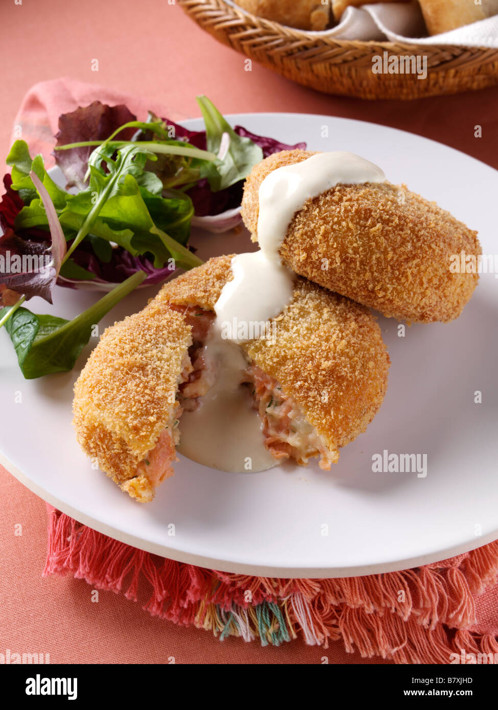 Smoked salmon fishcakes with hollandaise sauce Stock Photo Alamy