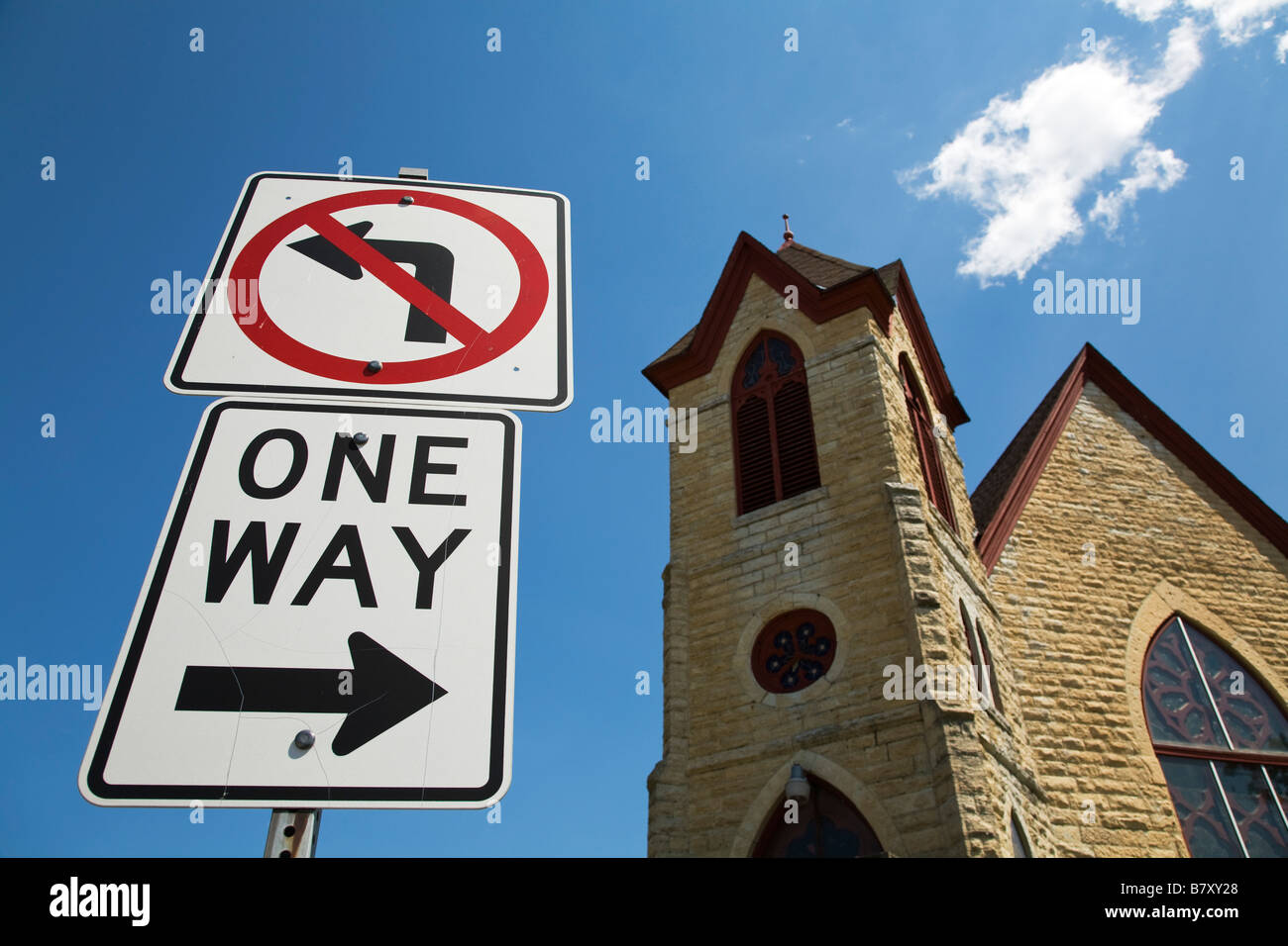 ILLINOIS DeKalb No Left Turn and One Way sign in front of small town church Stock Photo