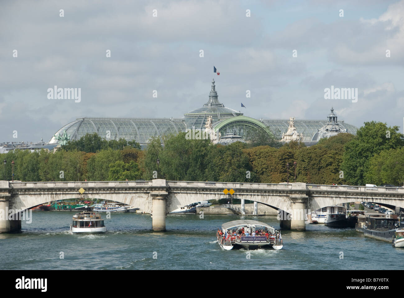 Bateau Mouche on River Seine Pont de la Concorde and Grand Palais in Paris France Stock Photo