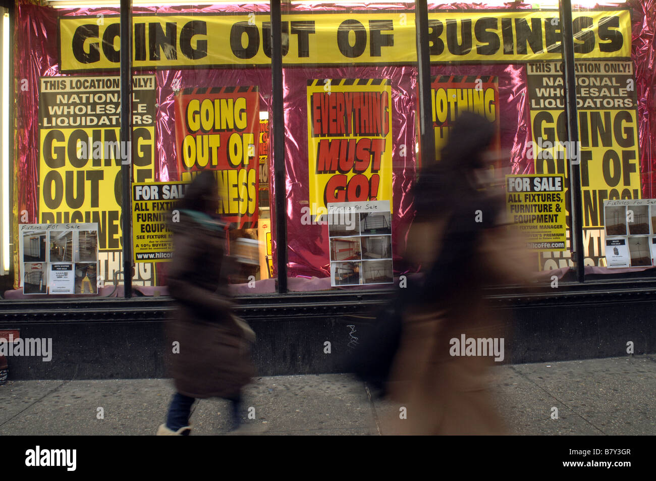 National Wholesale Liquidators in New York on Broadway advertises it s going out of business sale Stock Photo