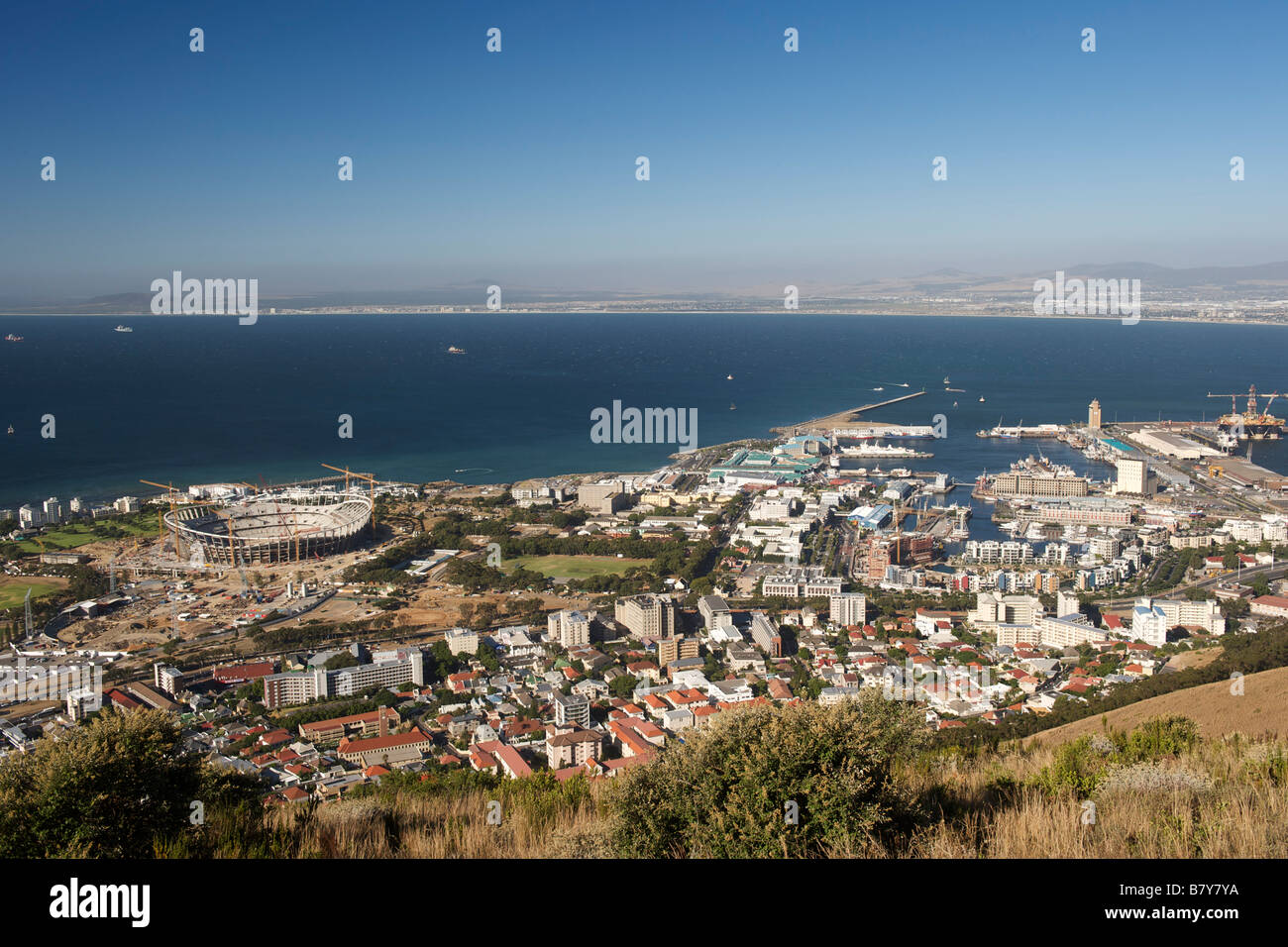 View of the V&A waterfront, the harbour, Table Bay and the 2010 FIFA world cup stadium under construction in Cape Town. Stock Photo