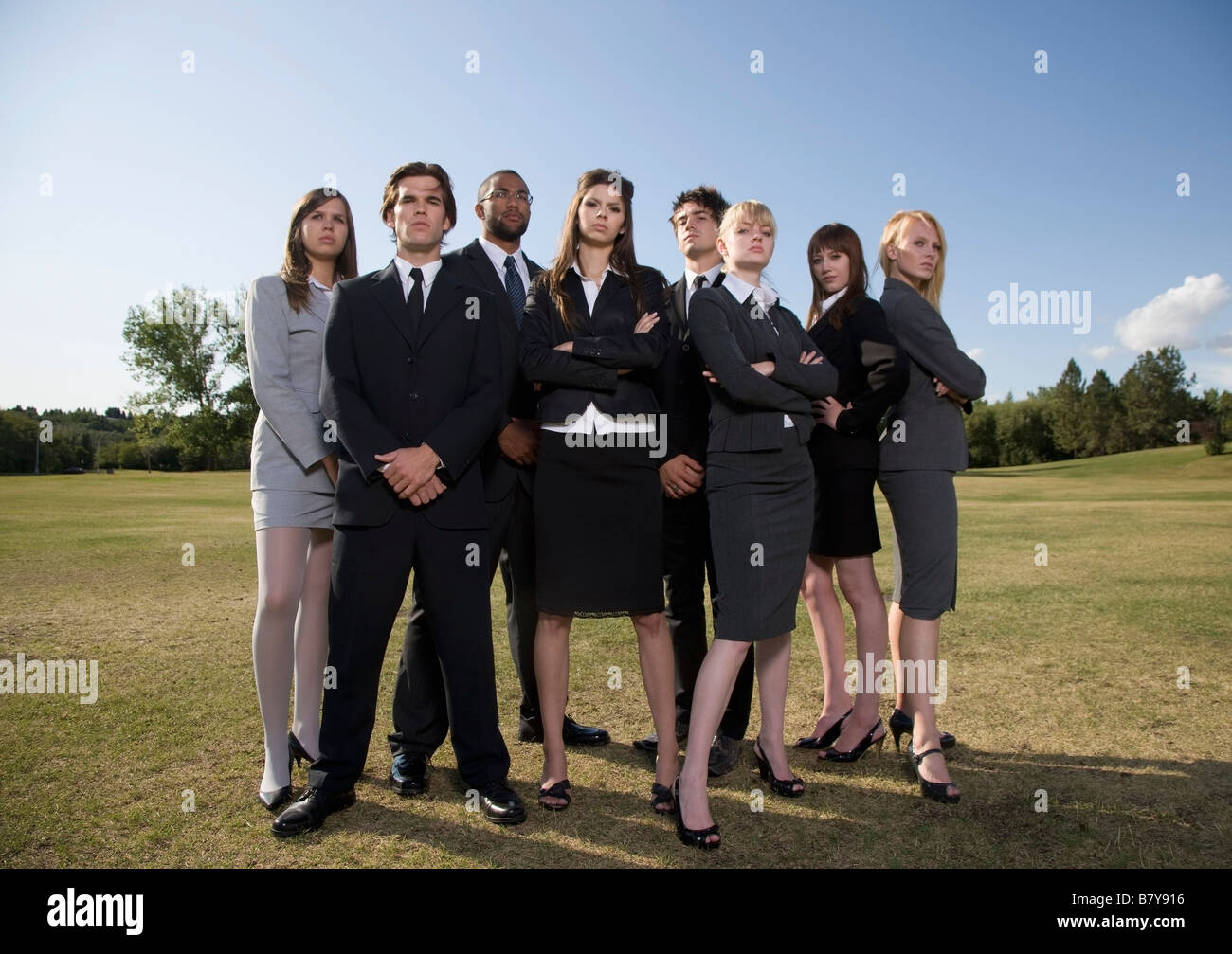 Posed group people suits hi-res stock photography and images - Alamy
