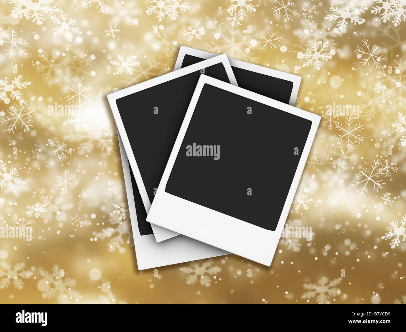 Polaroids on golden background of falling snowflakes Stock Photo
