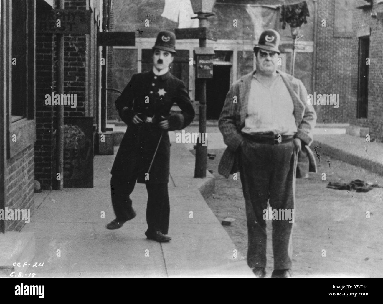 Easy Street  Year: 1917 USA Charles Chaplin, Eric Campbell  Director: Charles Chaplin Stock Photo