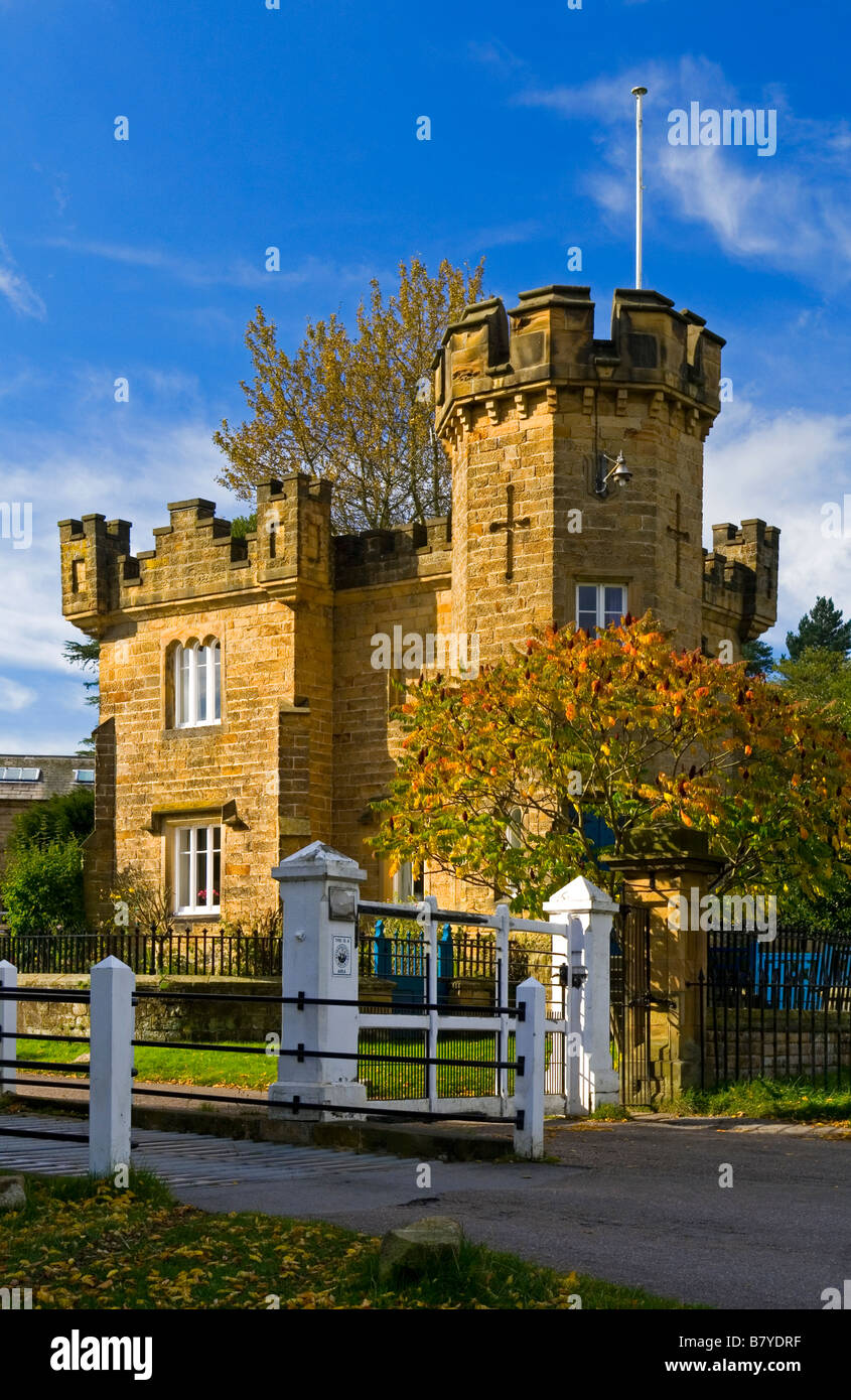 Castellated gate house in Edensor model village near Bakewell in the Derbyshire Peak District