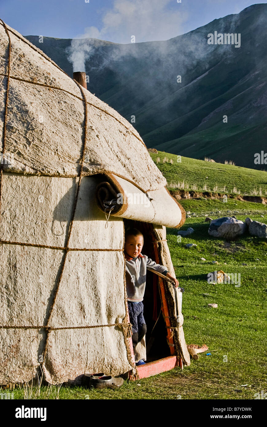 Kyrgyz boy at the yurt door Kyrgyz mountains Stock Photo
