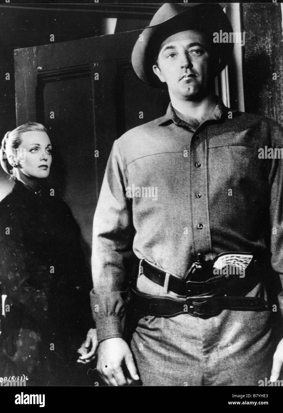 Man with the Gun  Year: 1955 USA Director: Richard Wilson Robert Mitchum, Jan Sterling Stock Photo