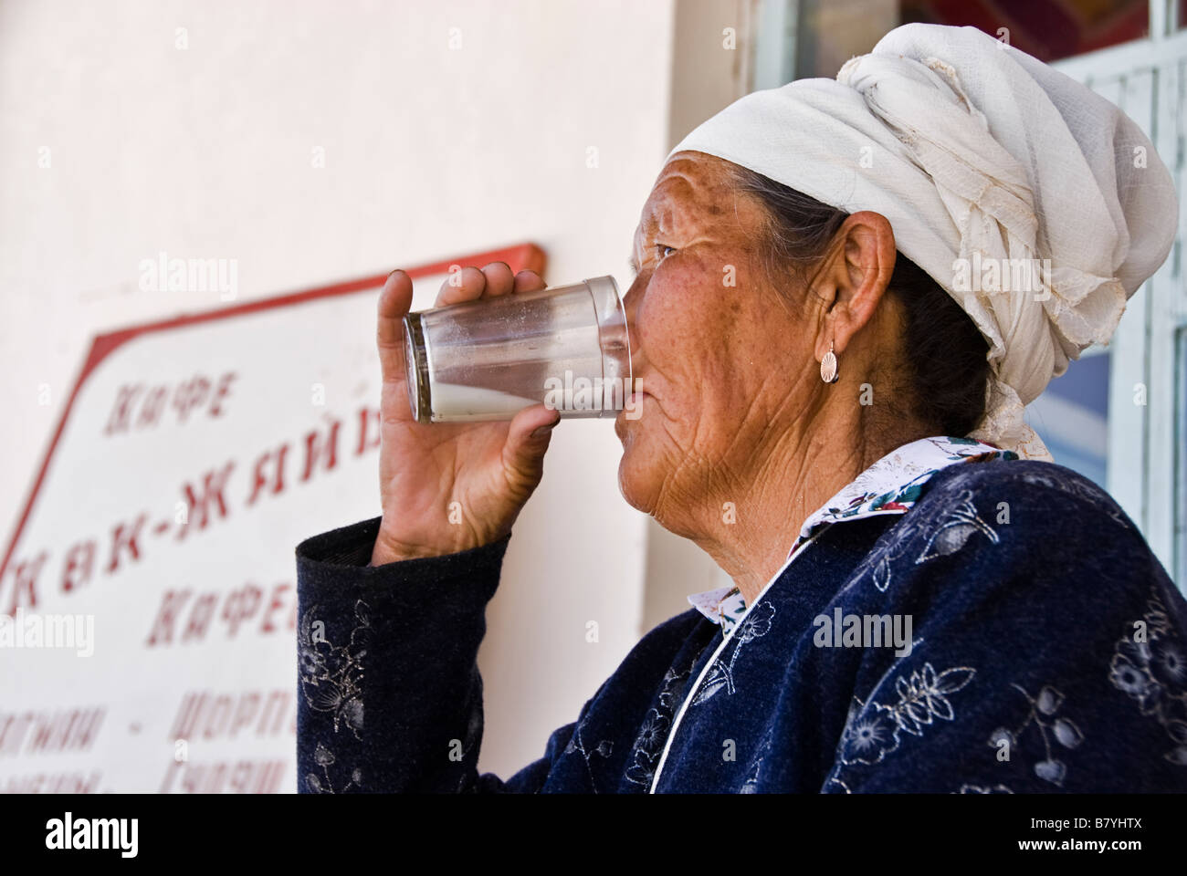 Kyrgyz woman drinking horse milk Kyrgyzstan Stock Photo