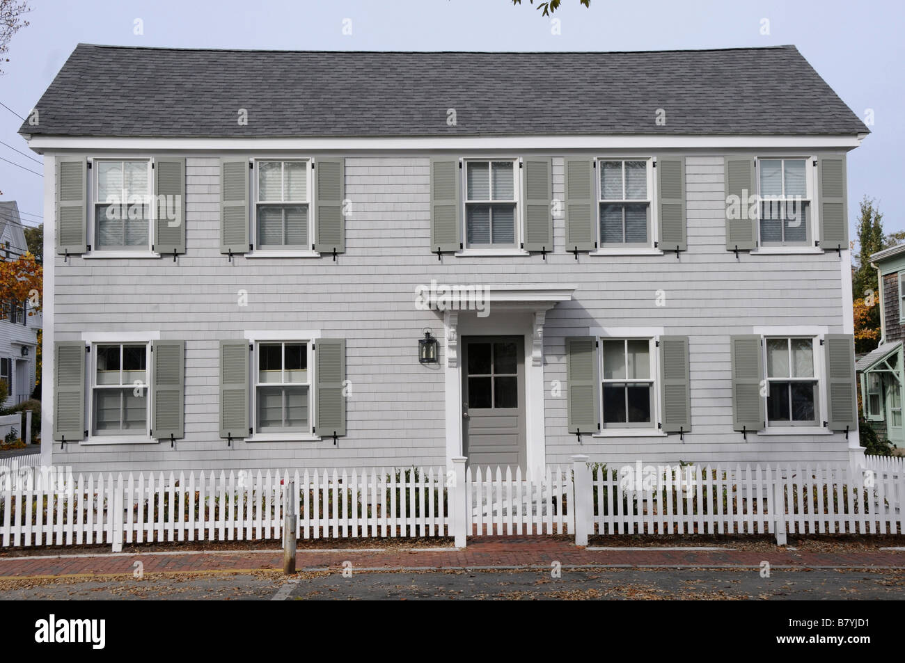 New England Home with White Picket Fence Stock Photo Alamy