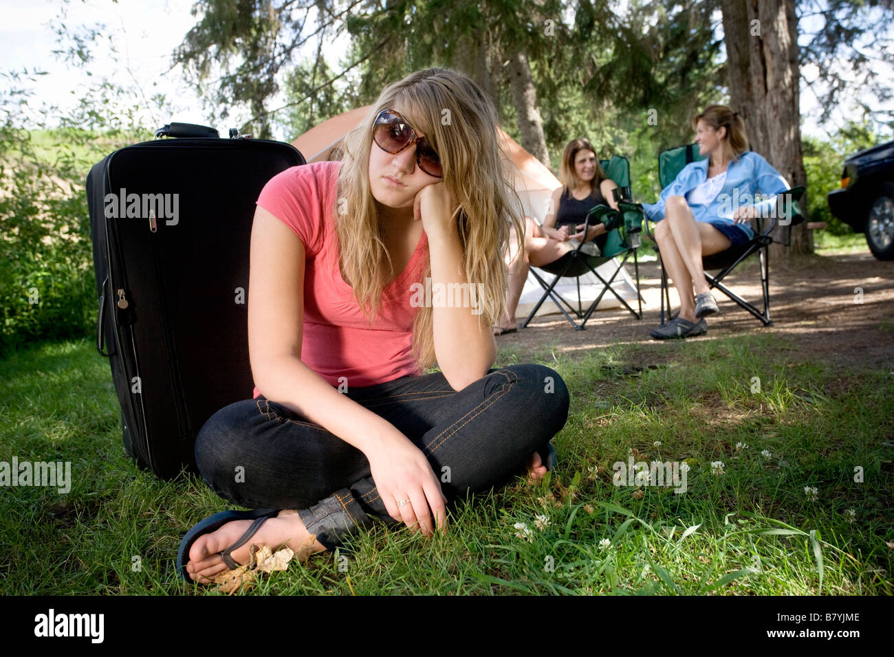 Bored on a camping trip Stock Photo Alamy
