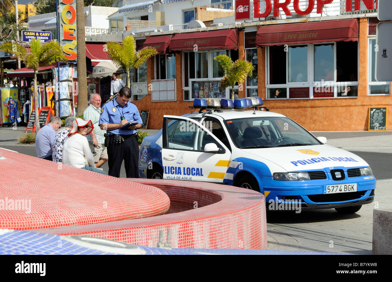 Scene of crimes spanish male police officer taking notes on the roadside Stock Photo