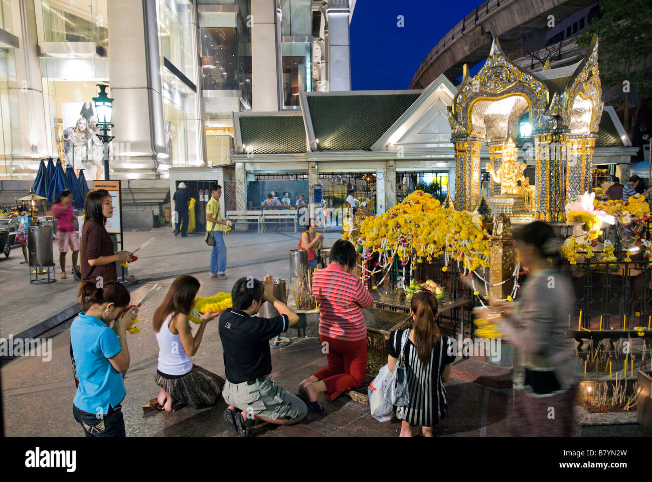 The Erawan buddhist shrine on the forecourt of the upmarket Erawan shopping mall Pathumwan district in central Bangkok Thailand Stock Photo