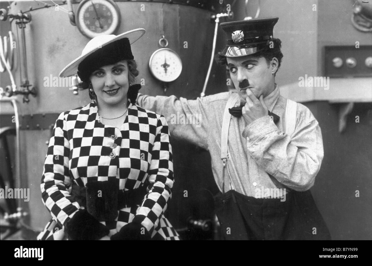 The Fireman  Year: 1916 USA Charlie Chaplin, Edna Purviance  Director: Charles Chaplin Stock Photo