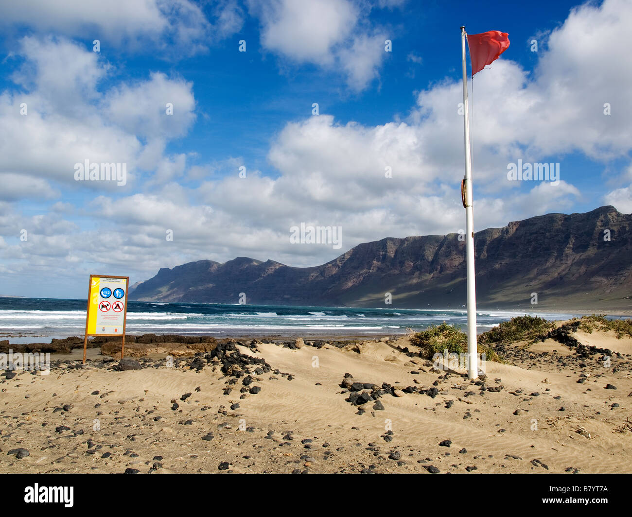 Playa de Famara beach with surf on the undeveloped North West coast of Lanzarote Canary Islands Stock Photo