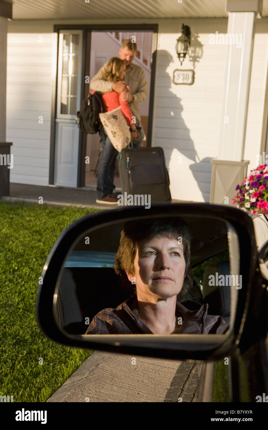 Young woman visiting dad with mom looking on Stock Photo