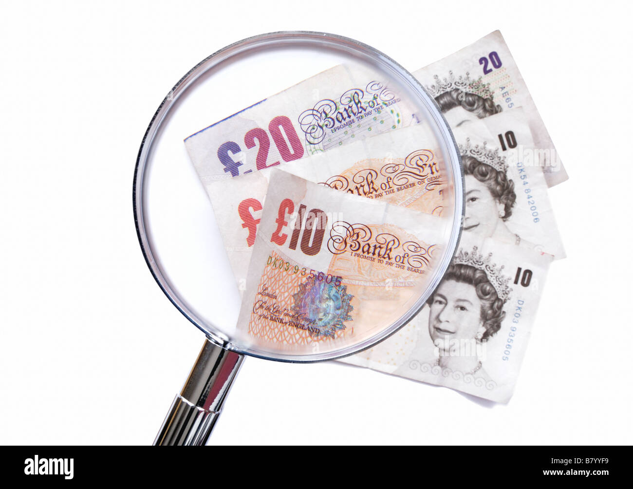 Money magnified to represent growth inflation Stock Photo