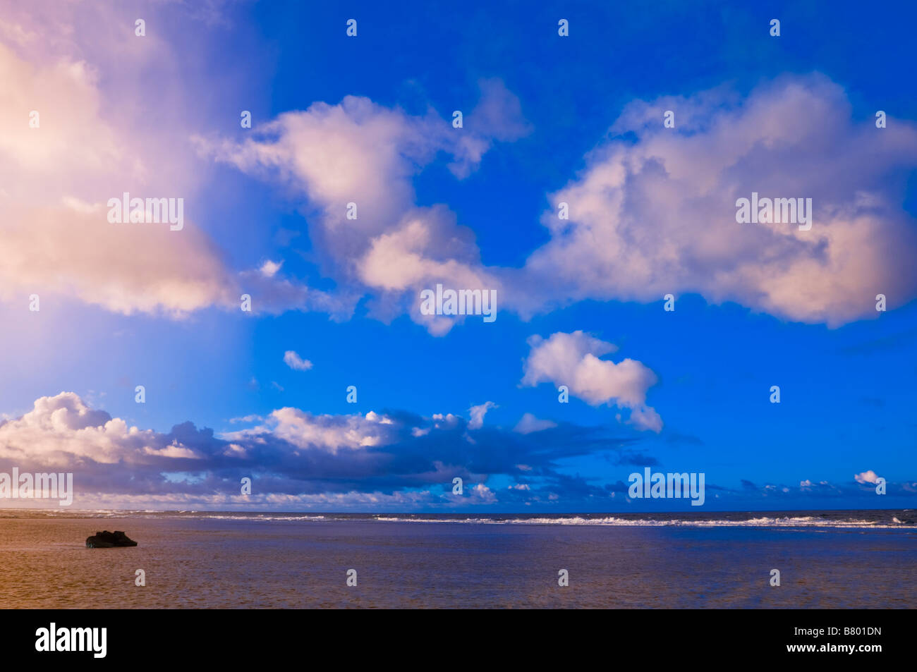 Evening light on waves breaking on reef at Tunnels Beach Island of Kauai Hawaii Stock Photo Alamy