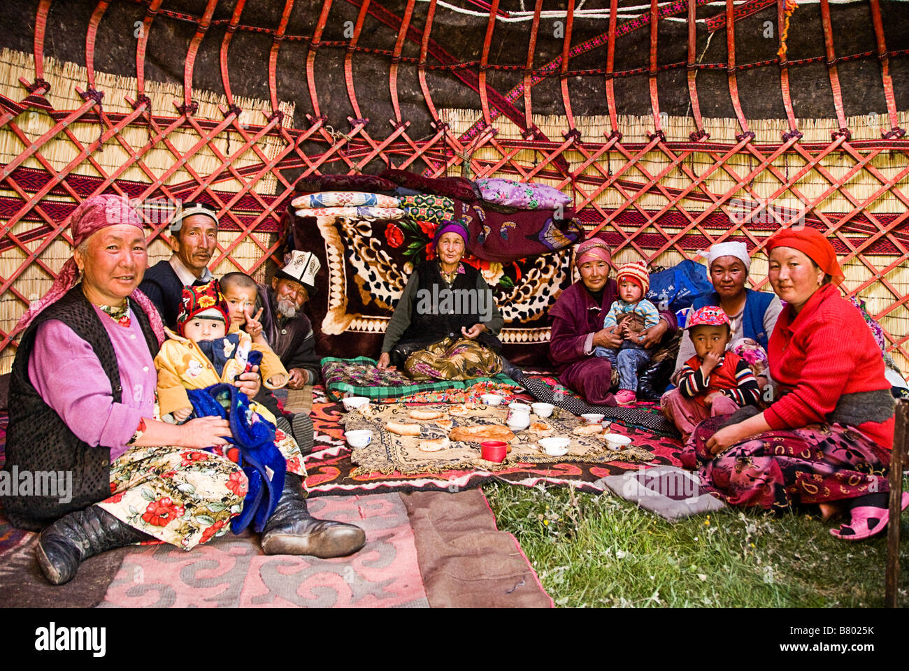 Kyrgyzs family in a yurt Near Irkestan pass Kyrgyzstan Stock Photo