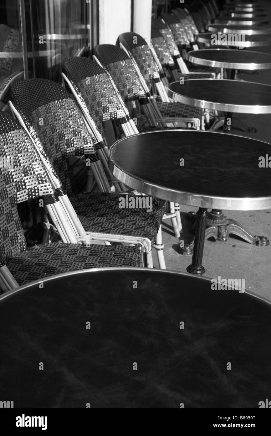 Tables and seats outside a cafe at Rue de Rivoli Paris France Stock Photo