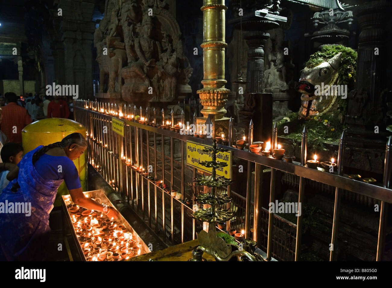 Nandi and candles in front of the main shrine in Shree Meenakshi Temple in Madurai in Tamil Nadu India Stock Photo