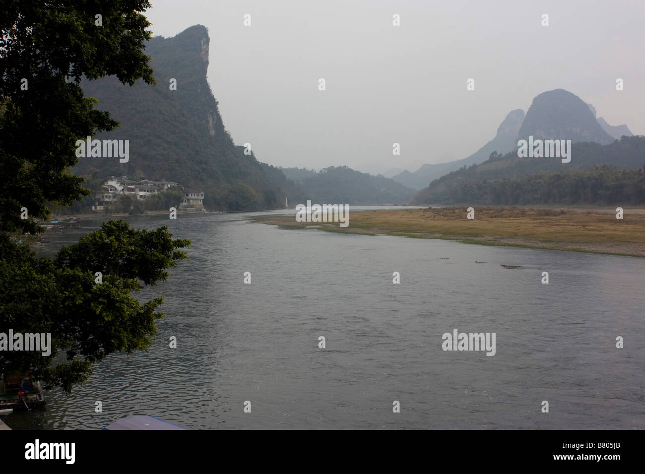 The dreamy landscape of the Li River, Yangshuo, China,  as you cruise along the river in a bamboo raft on a winter day Stock Photo